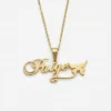 Gold personalized nameplate necklace reading Paige decorated with a small butterfly