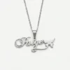 silver custom name necklace spelling Paige with a butterfly charm